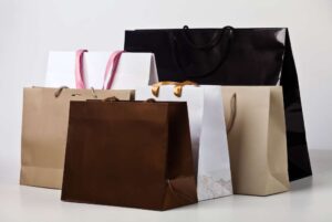 Premium fashion packaging carry bags for clothing brands and boutiques – eco-friendly, stylish, and customized to enhance brand identity in the fashion industry.